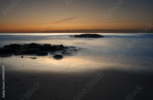 Long exposure of the Atlantic ocean during sunrise in Belmar New Jersey