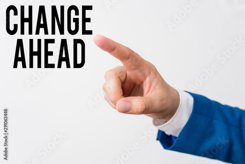 Writing note showing Change Ahead. Business concept for Some alterations waiting to happen Perspective Standby Isolated hand pointing with finger. Business concept pointing finger
