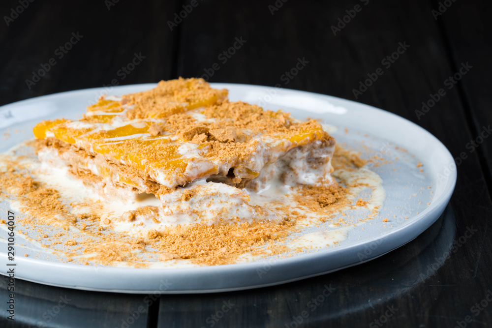 mango float, a well known easy to prepare Filipino dessert consist of cream, condensed milk, mango and graham crackers mango float, a well known easy to prepare Filipino dessert consist of cream, condensed milk, mango and graham crackers