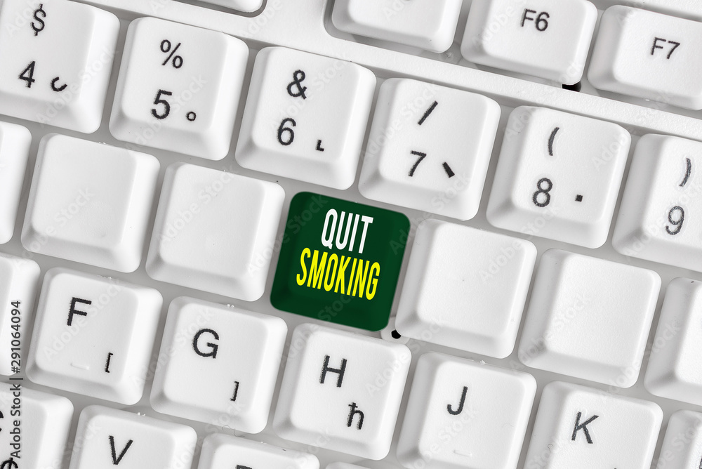 Handwriting text Quit Smoking. Conceptual photo Discontinuing or stopping the use of tobacco addiction White pc keyboard with empty note paper above white background key copy space Handwriting text Quit Smoking. Conceptual photo Discontinuing or stopping the use of tobacco addiction White pc keyboard with empty note paper above white background key copy space