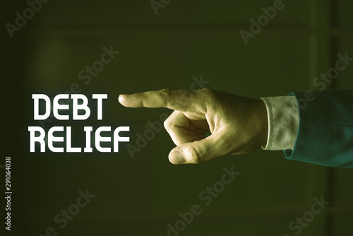 Handwriting text writing Debt Relief. Conceptual photo partial or total remission of it especially those by countries Isolated hand pointing with finger. Business concept pointing finger photo