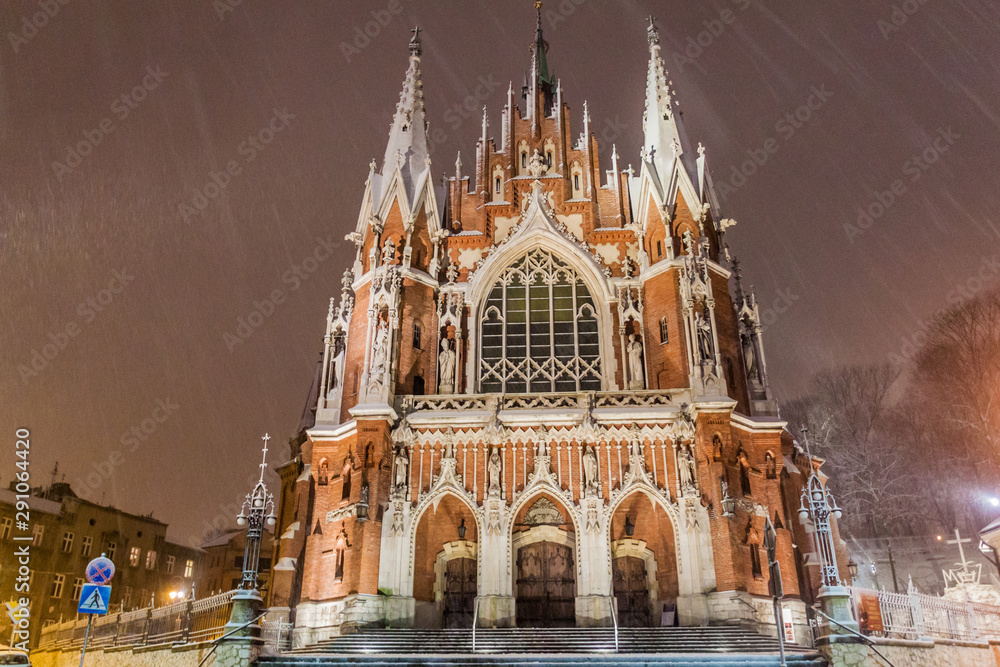 Night snowy view of St. Joseph's Church in Krakow, Poland