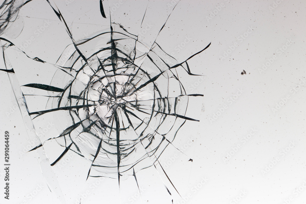 Cracked glass on a white background texture