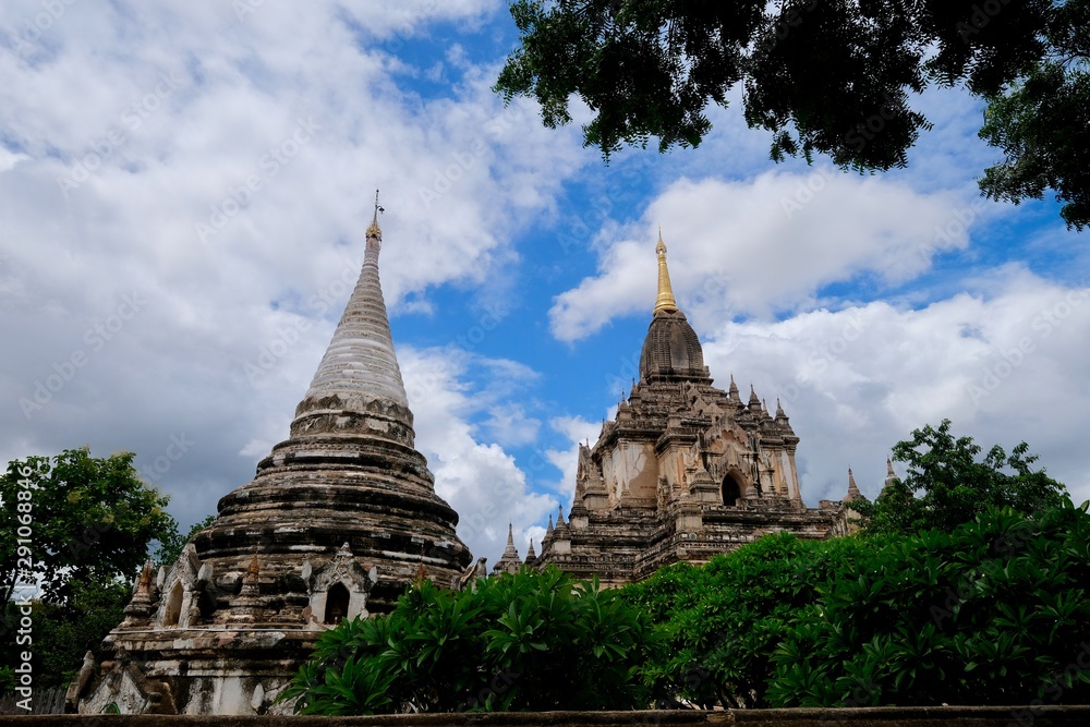 looking up to Gawdawpalin Temple under blue sky white clouds. The second highest pahto in Bagan Myanmar. Wide angle
