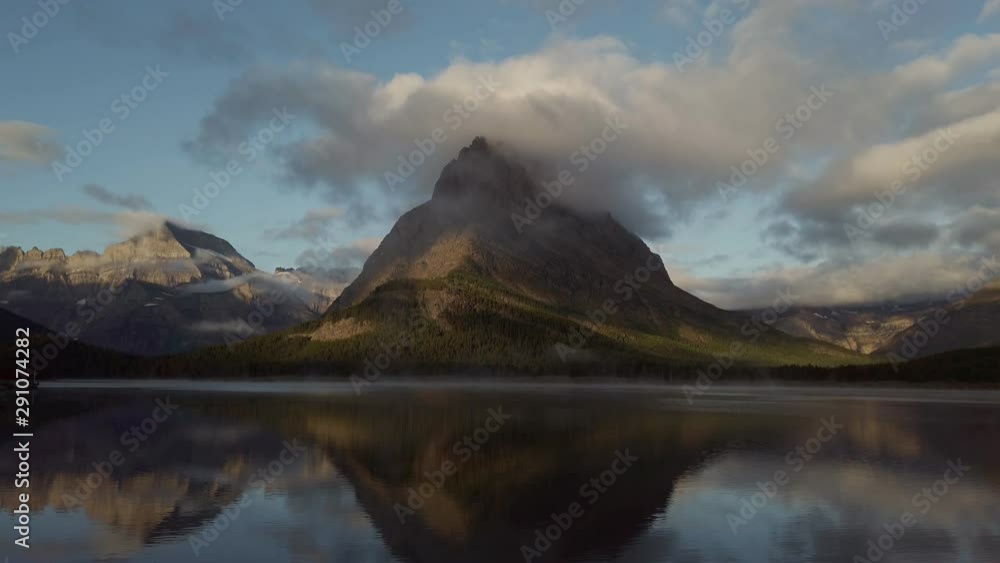 Sunrise of the Mount Wilbur, Swiftcurrent Lake in the Many Glacier area of the famous Glacier National Park Sunrise of the Mount Wilbur, Swiftcurrent Lake in the Many Glacier area of the famous Glacier National Park