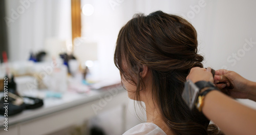 Woman having hair style in beauty salon