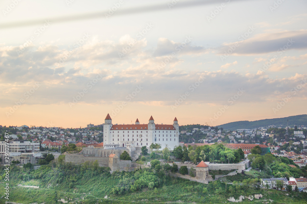 Beautiful view of the Bratislava castle on the banks of the Danube in the old town of Bratislava, Slovakia on a sunny summer day.