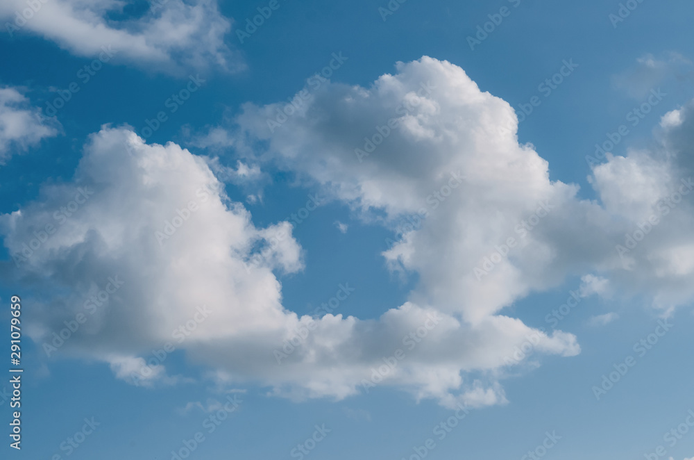 light and fluffy clouds on the blue sky light and fluffy clouds on the blue sky
