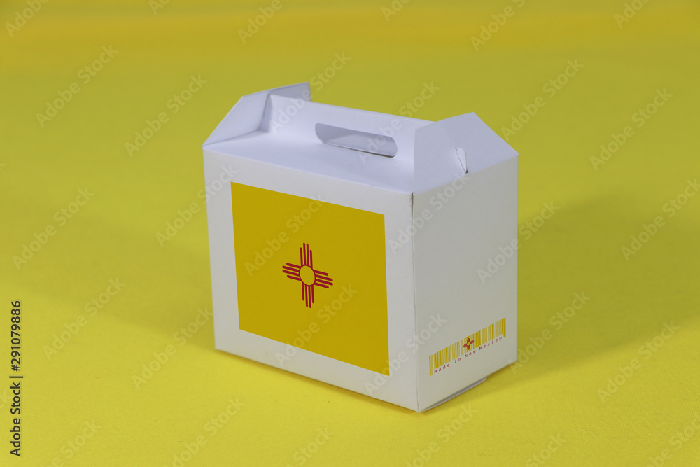 New Mexico flag on white box with barcode and the color of states flag on yellow background. The concept of export trading from New Mexico. New Mexico flag on white box with barcode and the color of states flag on yellow background. The concept of export trading from New Mexico.