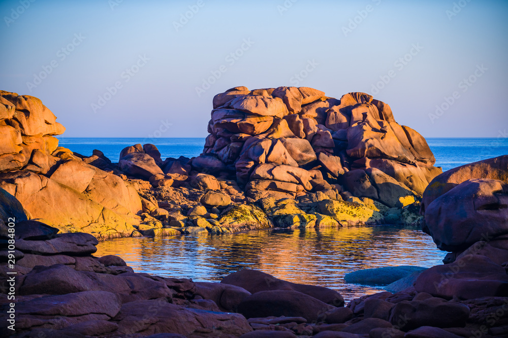 The incredible Pink Granite Shore near the village of Plumanach at sunrise.The coast of Pink Granite is a unique place in Brittany. France
