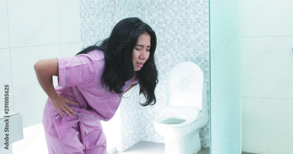 Young woman has stomach ache on the morning in the bathroom at home. Shot in 4k resolution Young woman has stomach ache on the morning in the bathroom at home. Shot in 4k resolution