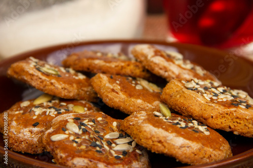 homemade honey cookies with seeds on a plate. tea time. Sweet treat for the holiday