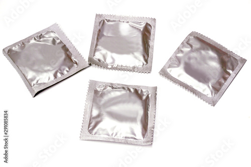 Condoms in seal package isolate on white background.