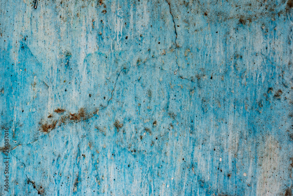 Texture of a concrete wall with cracks and scratches which can be used as a background Texture of a concrete wall with cracks and scratches which can be used as a background