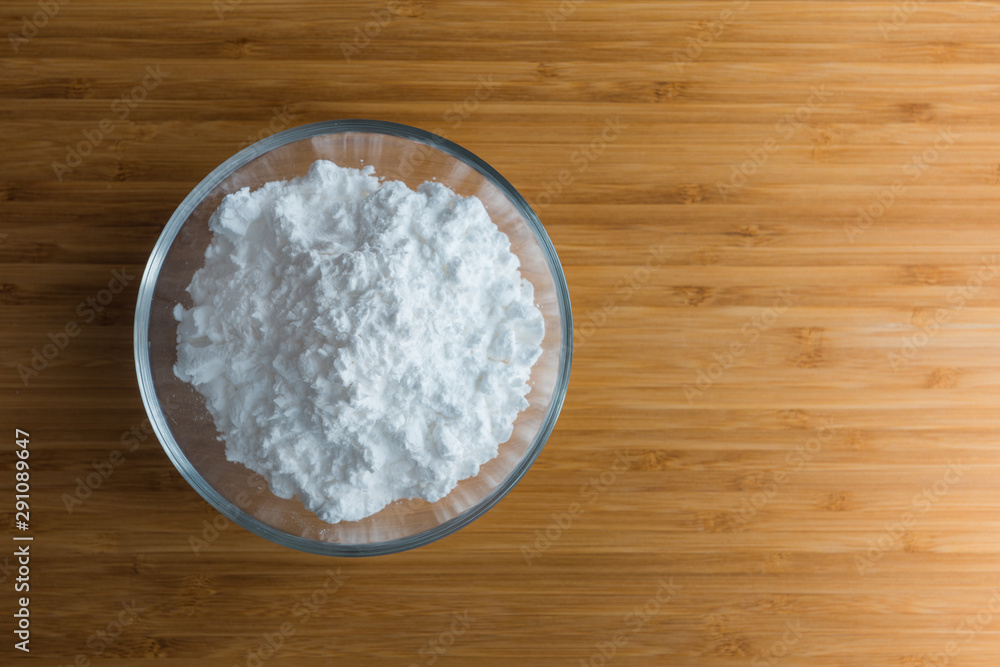 Top view tapioca starch powder in wooden bowl background isolate Top view tapioca starch powder in wooden bowl background isolate
