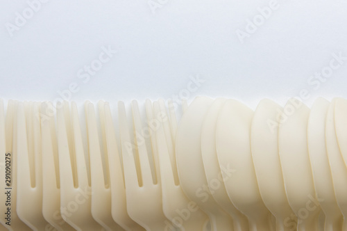 Biodegradable plastic spoon and fork on white background