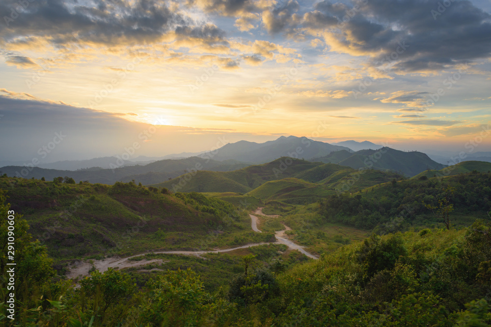 Obraz premium Silhouette of Mountain With Fluffy Clouds during Sunrise at Noen Chang Suek, Kanchanaburi, Thailand