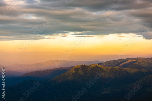 Silhouette of Mountain With Fluffy Clouds during Sunrise at Noen Chang Suek, Kanchanaburi, Thailand © Pawarun