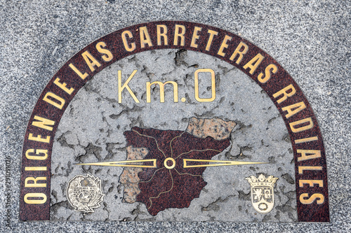 Puerta del Sol / Madrid - September 17 2019: Km 0 in Madrid at Plaza del Sol. Mark at the floor showing the begging of the roads to deliver mail many years ago