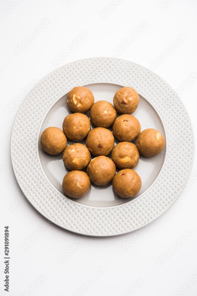 Churma Ladoo / atta laddoo / wheat flour laddu made using ghee and jaggery or sugar. selective focus Churma Ladoo / atta laddoo / wheat flour laddu made using ghee and jaggery or sugar. selective focus