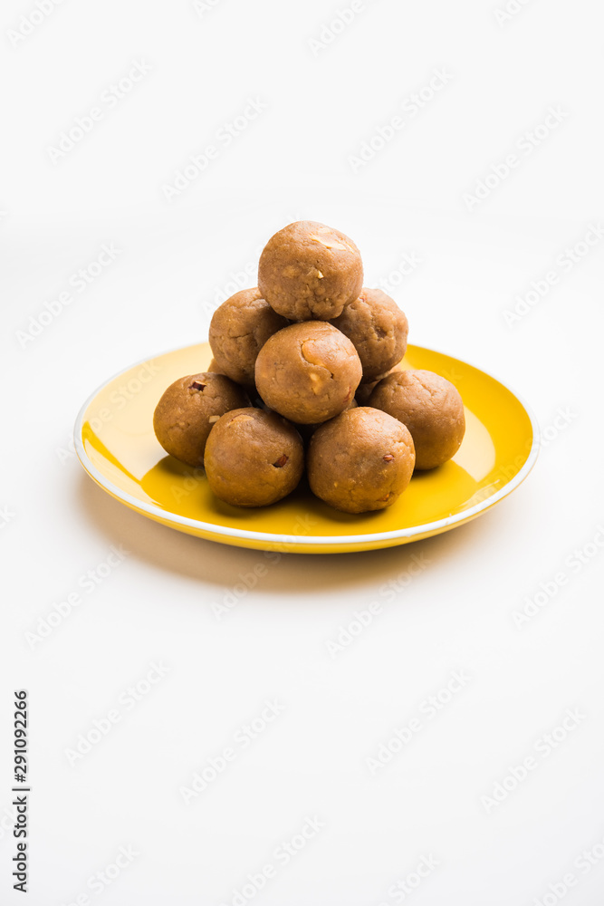 Churma Ladoo / atta laddoo / wheat flour laddu made using ghee and jaggery or sugar. selective focus Churma Ladoo / atta laddoo / wheat flour laddu made using ghee and jaggery or sugar. selective focus