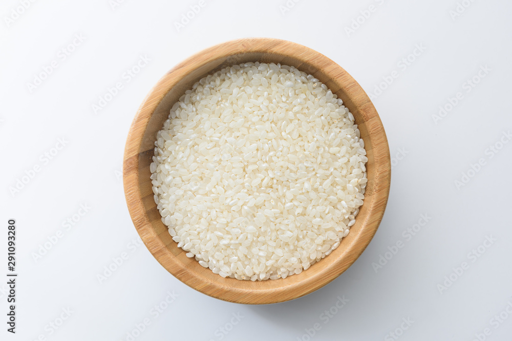 Top view close up of Thai jasmine rice uncook in glass bowl, a long-grain variety of fragrant rice, white background isolate, clipping path Top view close up of Thai jasmine rice uncook in glass bowl, a long-grain variety of fragrant rice, white background isolate, clipping path