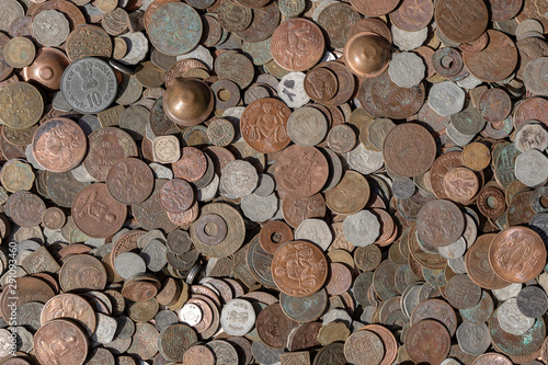 Old vintage fake coins background for sale to tourists in the Indian market on the street in Rishikesh  India. Close up