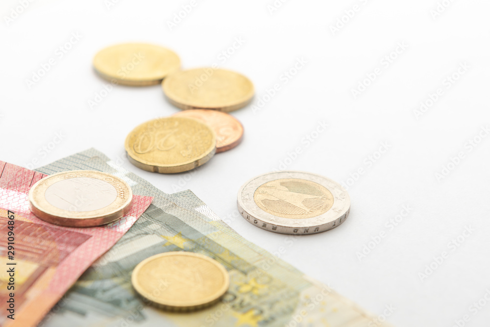 Close-up euro banknotes and coin background isolate Close-up euro banknotes and coin background isolate