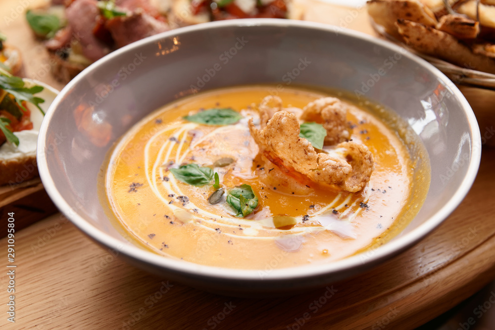 Deep plate with pumpkin soup, Italian restaurant Deep plate with pumpkin soup, Italian restaurant