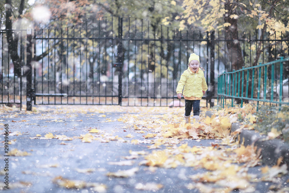 Kids walk in the park first snow Kids walk in the park first snow