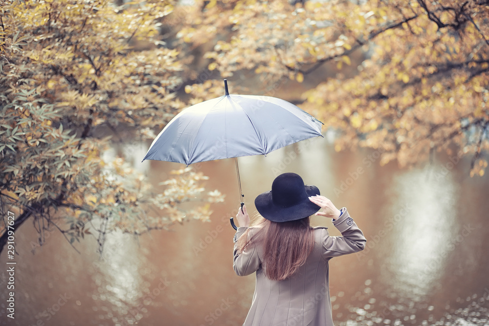 Young girl in a coat in autumn  park