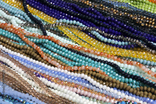colored pearl necklaces on display in a jewelry store