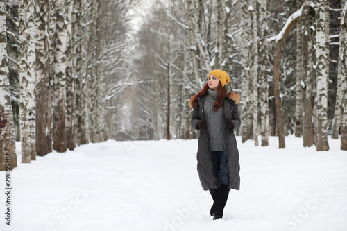 Beautiful girl in a beautiful winter park