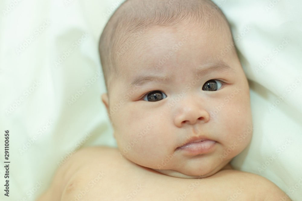 Cute little baby looking into the camera Cute little baby looking into the camera