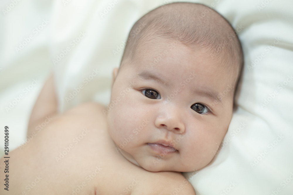 Cute little baby looking into the camera Cute little baby looking into the camera