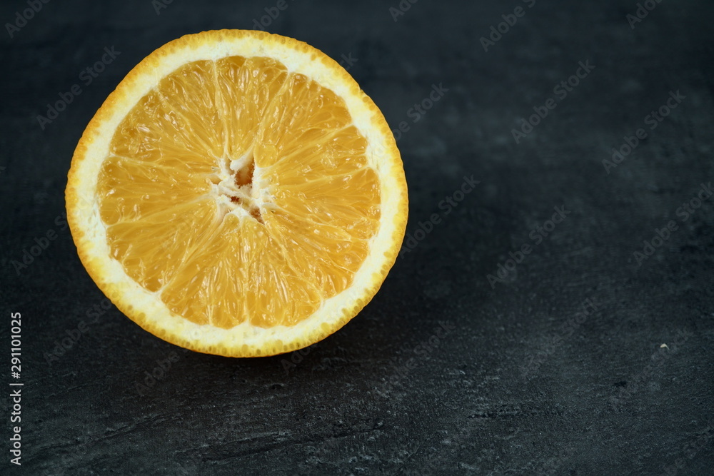 Fresh sliced oranges and on gray background Fresh sliced oranges and on gray background