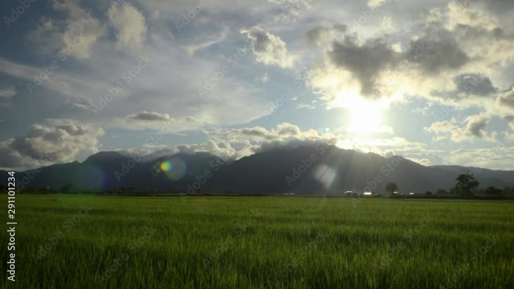 Sunset mountain range background, blue sky, cloudy green grass field, tropical , summer , right pan Sunset mountain range background, blue sky, cloudy green grass field, tropical , summer , right pan