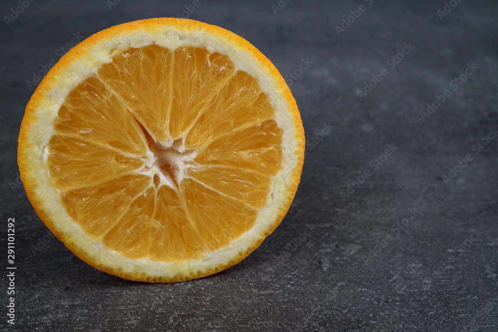 Fresh sliced oranges and on gray background Fresh sliced oranges and on gray background