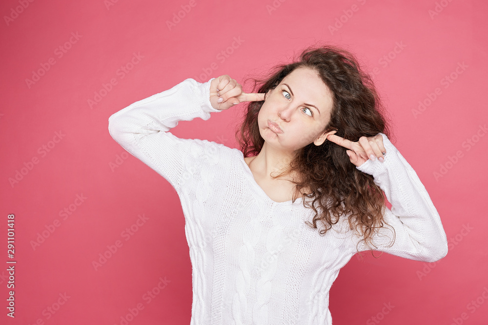 Funny childish young Caucasian female with funky hair blowing cheeks bursting out, grimacing, having joy, looking happily into camera. Lucky female amazing herself. Positive body language emotions... Funny childish young Caucasian female with funky hair blowing cheeks bursting out, grimacing, having joy, looking happily into camera. Lucky female amazing herself. Positive body language emotions...