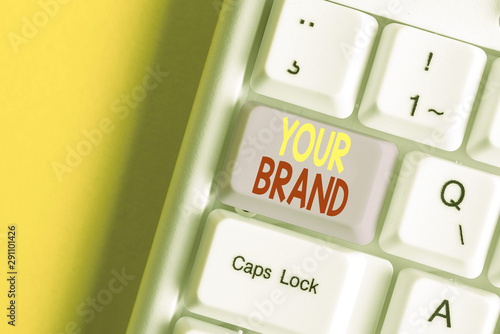 Word writing text Your Brand. Business photo showcasing A name of any kind that is impacted to something as trademark White pc keyboard with empty note paper above white background key copy space photo