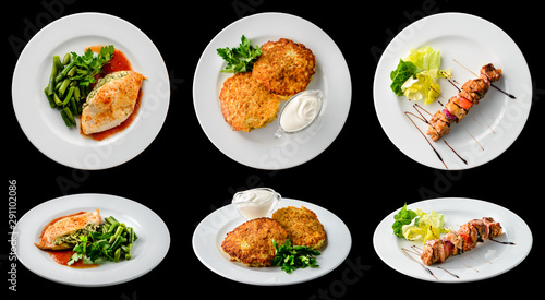 chicken fillet, potato pancakes and kebab with vegetables isolated on black