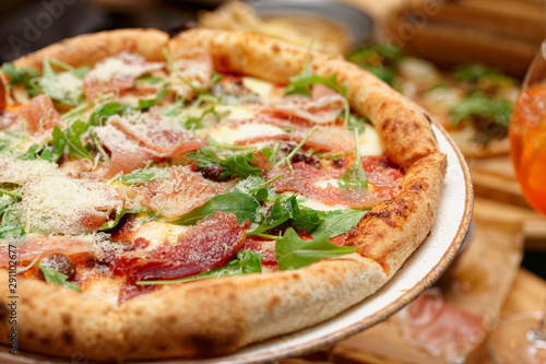 Pizza with prosciutto ham and parmesan
