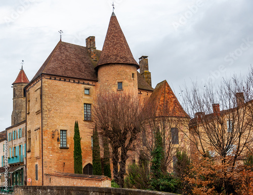 Belves, in the Dordogne-Périgord region in Aquitaine, France. Medieval village with typical houses perched on the hill, among pastures and green countryside.