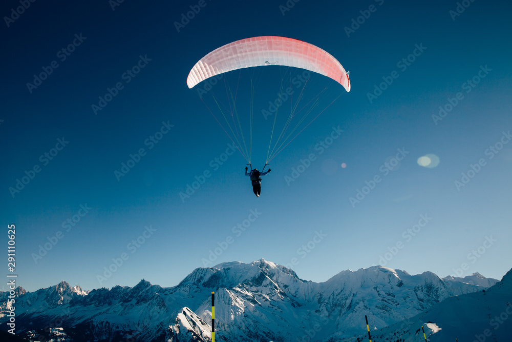 Paraglider silhouette in French Alps. Paraglider silhouette in French Alps.