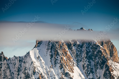View from Aiguille du Midi, France. Skiers going down on Mer de Glace .
