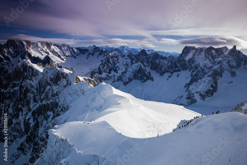 View from Aiguille du Midi, France. Skiers going down on Mer de Glace .