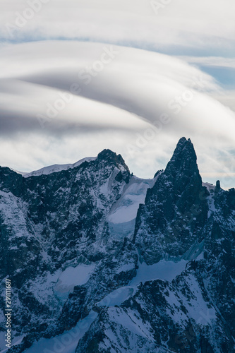 View from Aiguille du Midi, France. Skiers going down on Mer de Glace . photo