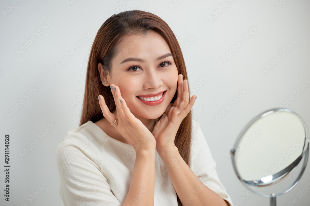 face of young beautiful healthy woman looking in the mirror face of young beautiful healthy woman looking in the mirror
