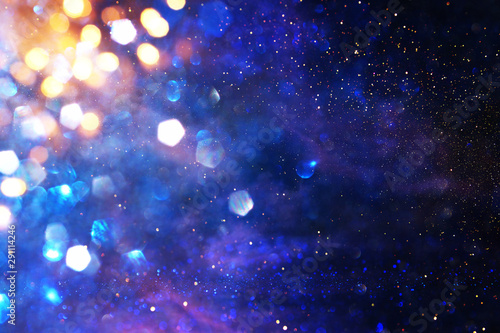 abstract glitter silver, gold , blue lights background. de-focused.