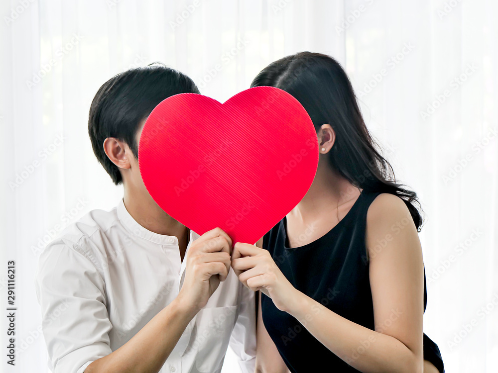 Happy couple in love holding red heart shape, valentine concept. Happy couple in love holding red heart shape, valentine concept.
